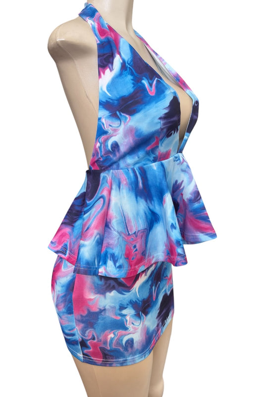Colorful dress on a mannequin against a white background