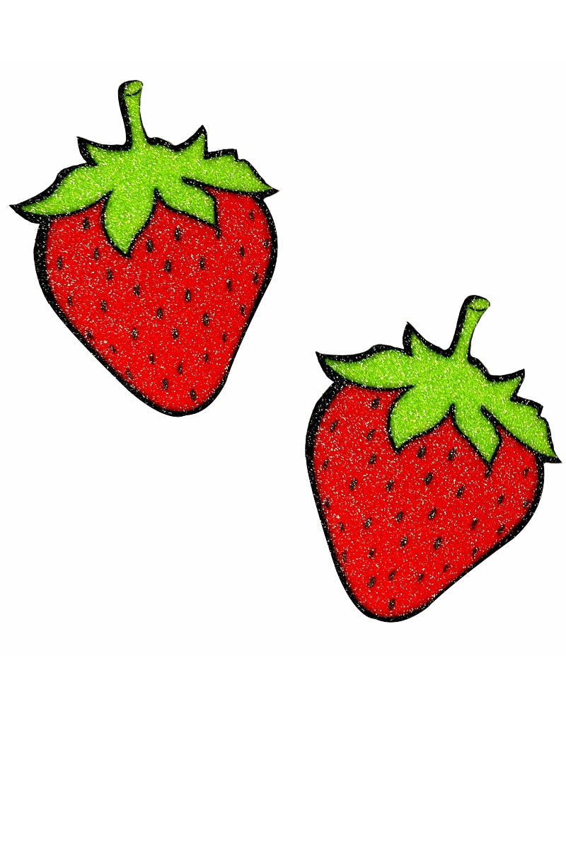 Two red strawberries with green leaves on a white background