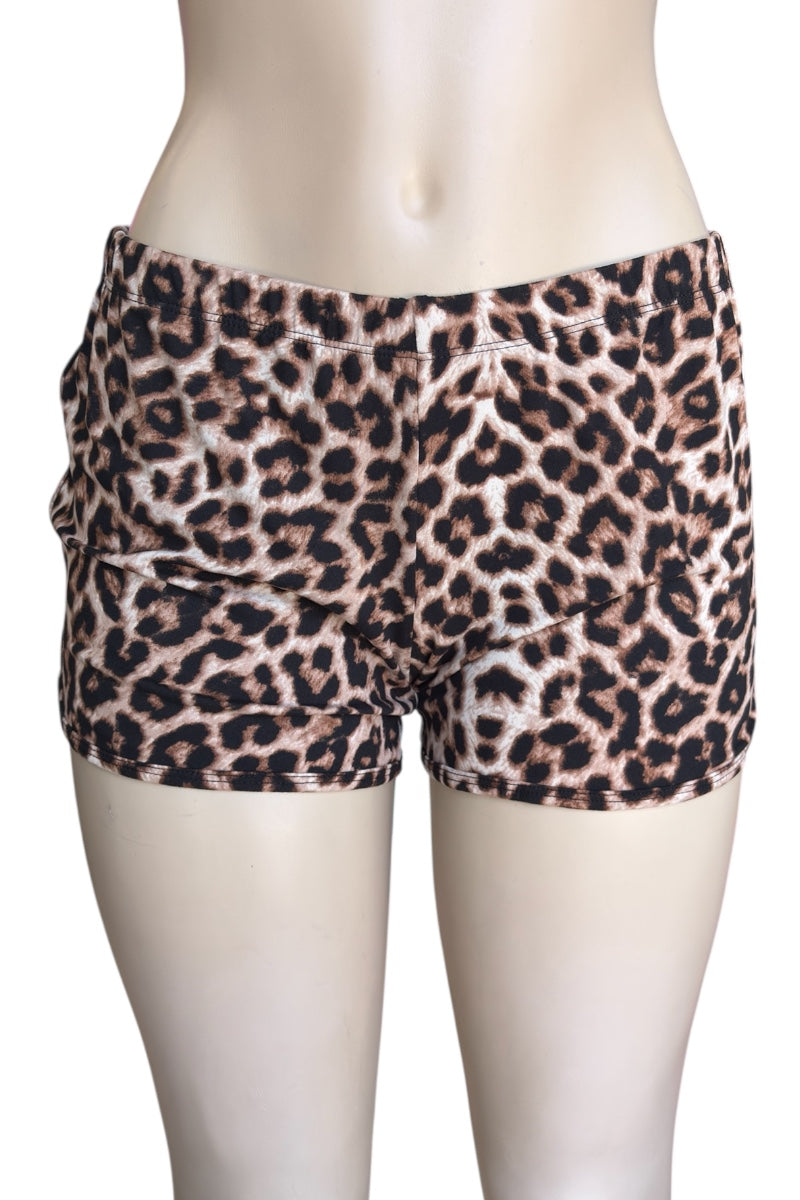 Leopard print shorts on a mannequin against a white background