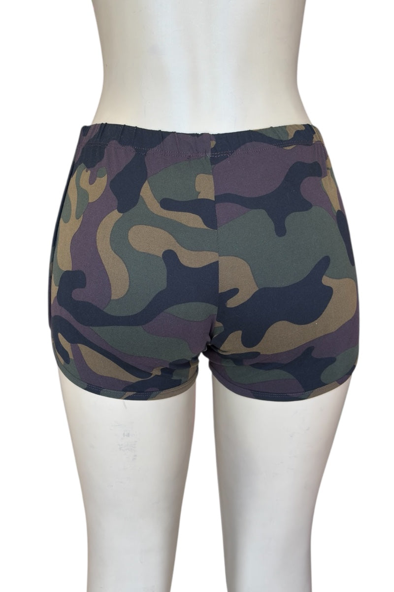 Camouflage shorts on a mannequin against a white background