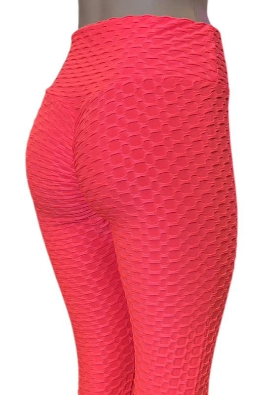 coral textured leggings on a white background