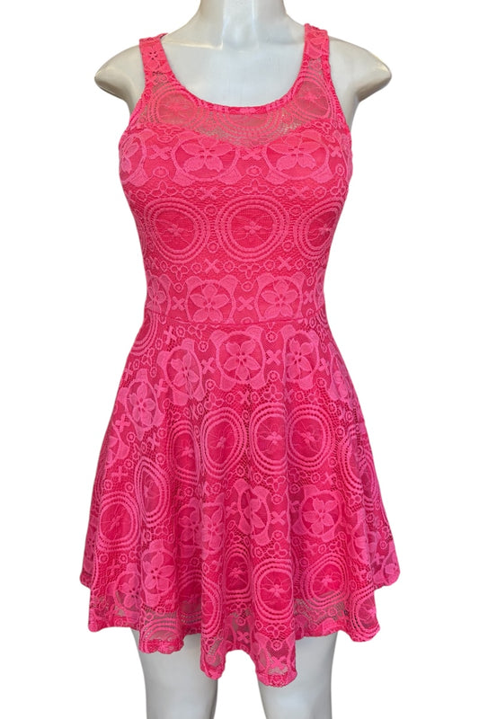 Pink lace dress on a mannequin against a white background