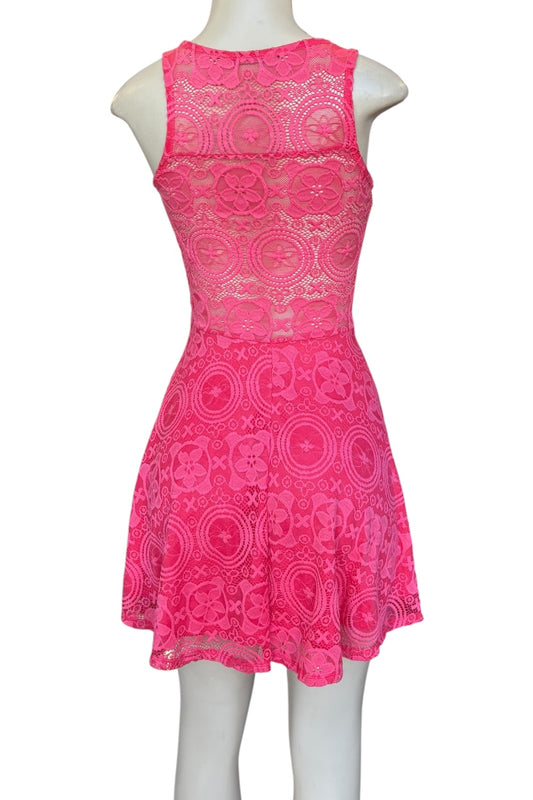 Pink lace dress on a mannequin against a white background