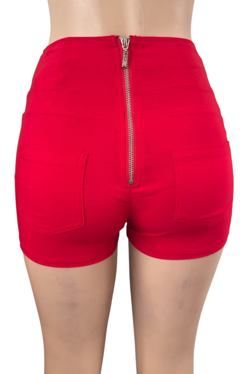 Red shorts with a zipper on a white background