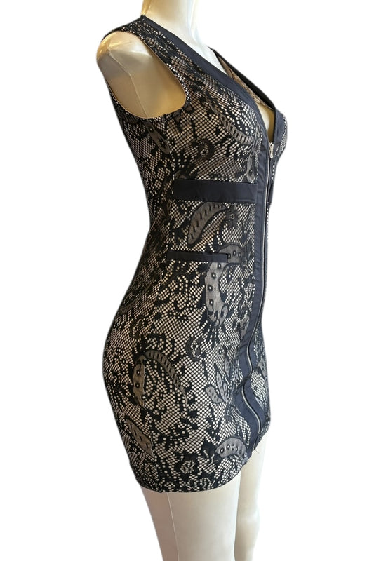 Black lace dress on a mannequin against a white background