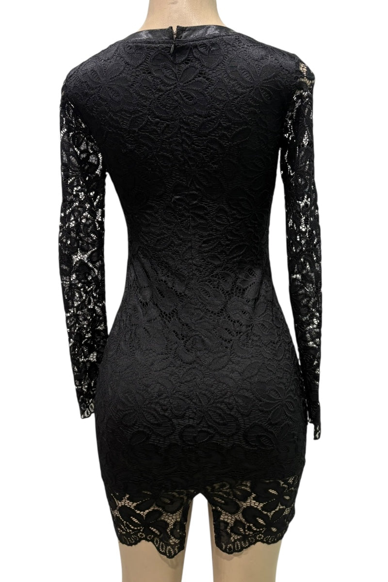 Black lace dress on a mannequin with a white background
