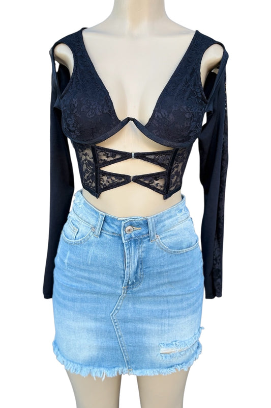 top with lace detailing and a denim skirt on a mannequin against a white background