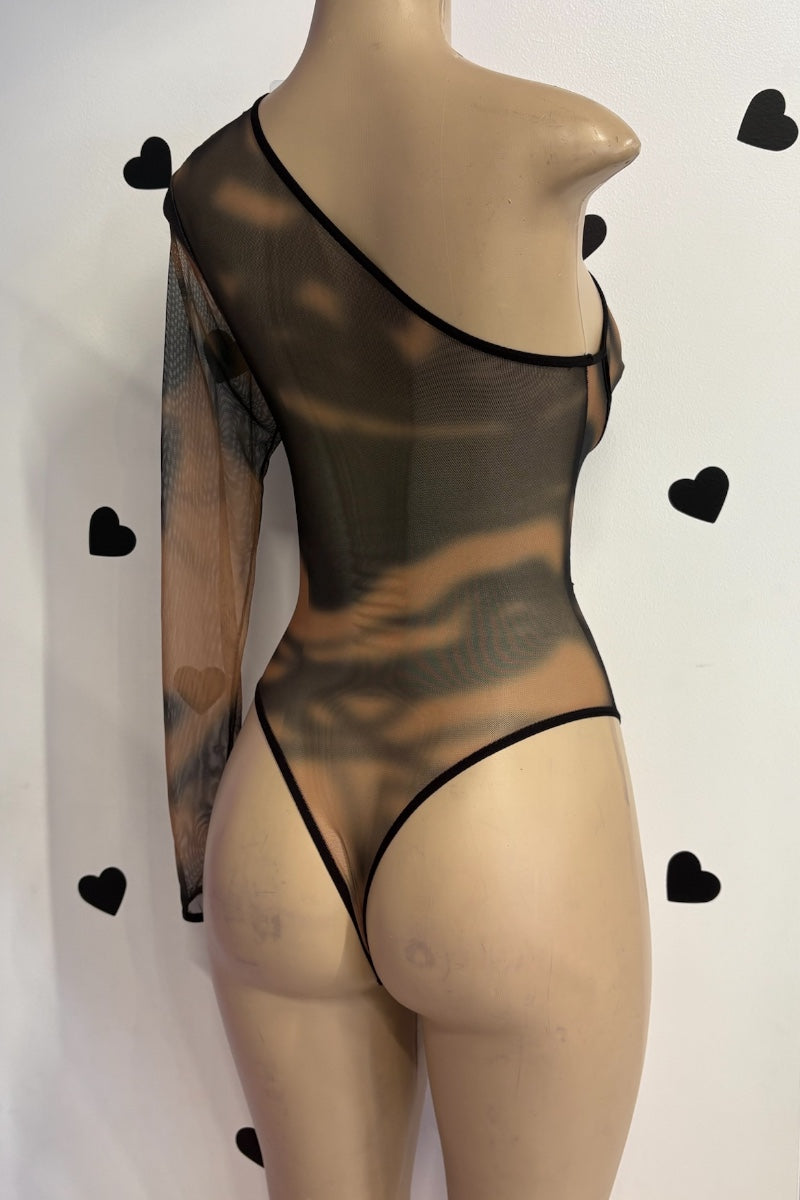 Mannequin wearing a sheer black bodysuit with heart-shaped cutouts on a white background.