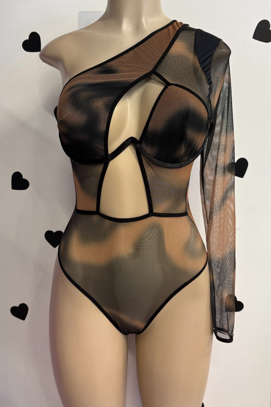 Sheer black bodysuit on a mannequin against a white background with black heart shapes.