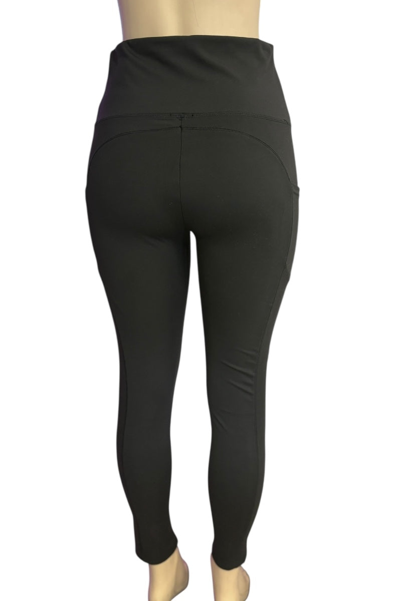 Black leggings on a mannequin against a white background