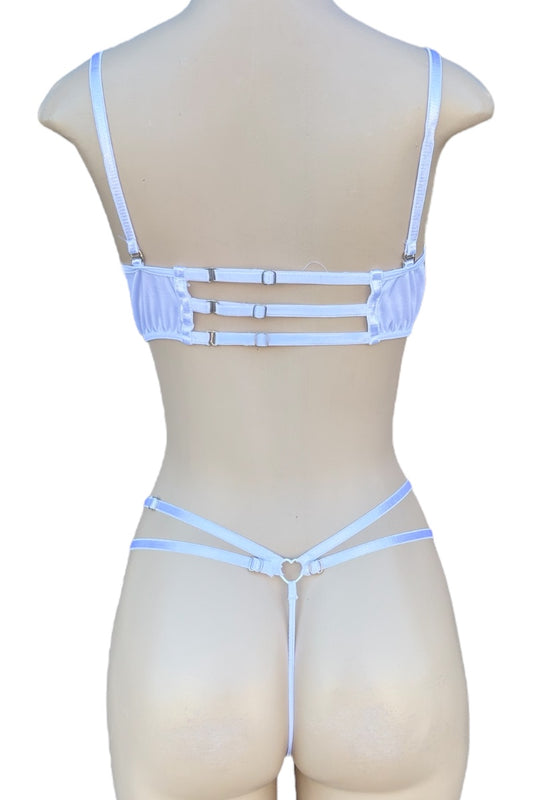 Mannequin wearing a white strappy lingerie set on a white background