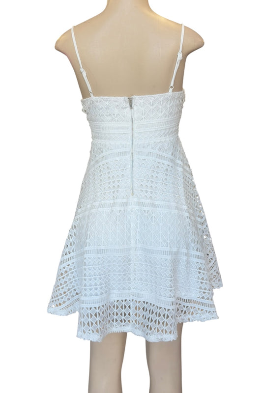 White lace dress on a mannequin against a white background