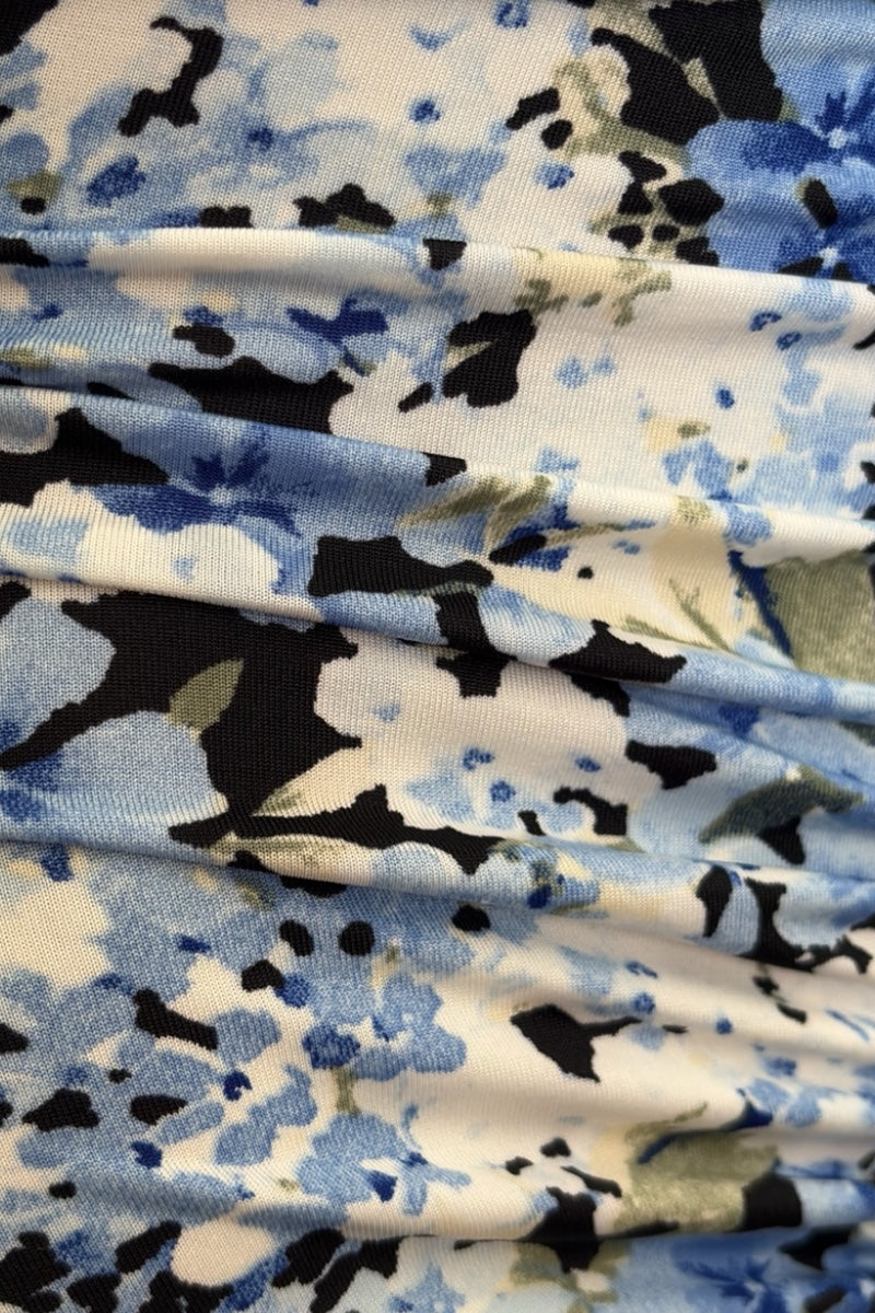 ruched fabric with blue, black, and white floral pattern