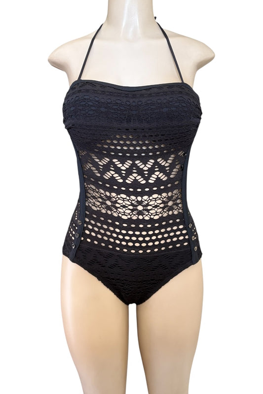 Black crochet swimsuit on a mannequin against a white background