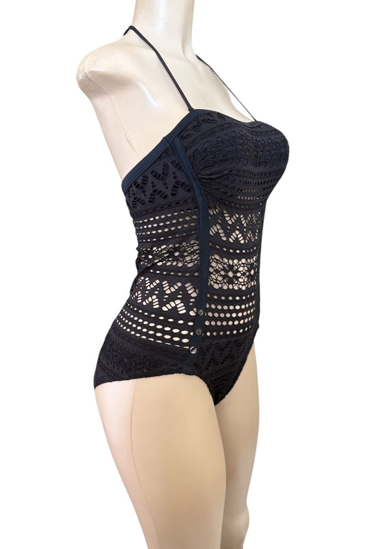 Black lace lingerie set on a mannequin against a white background