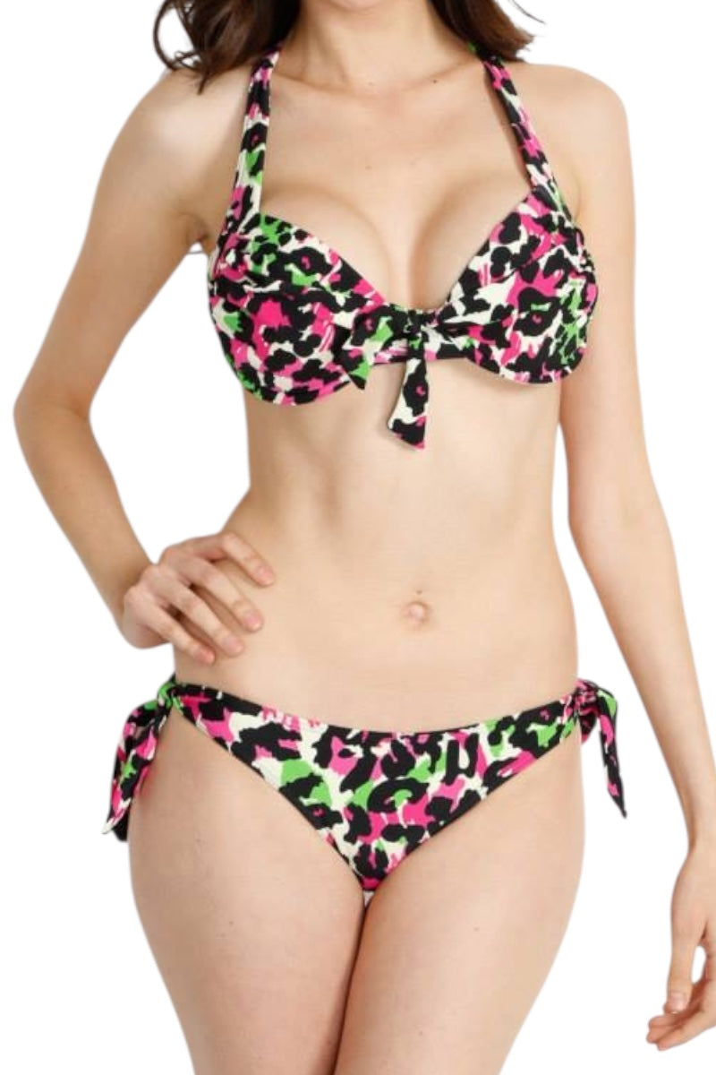 Woman wearing a colorful bikini with a white background