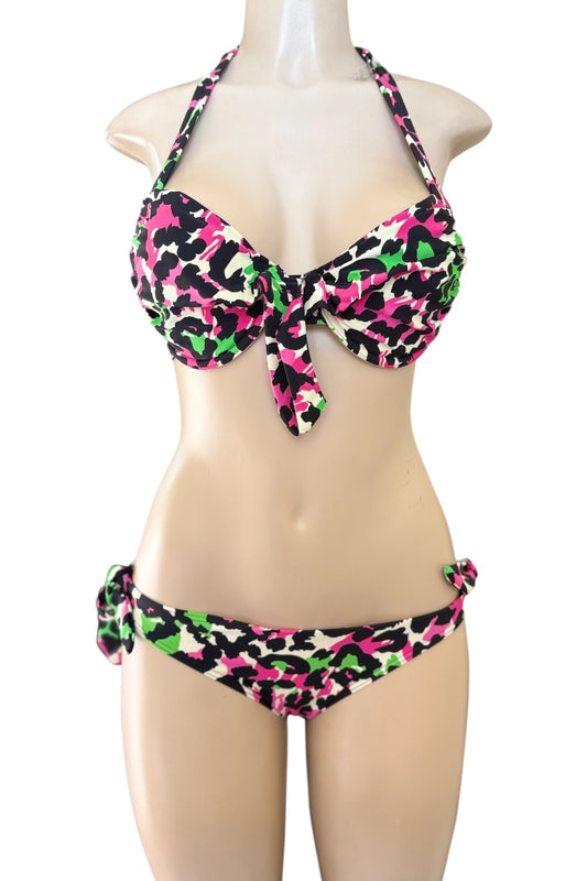 Colorful bikini set on a mannequin against a white background
