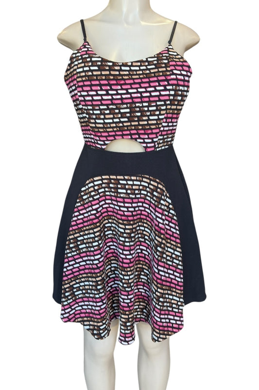 Mannequin wearing a dress with a patterned top and skirt on a white background