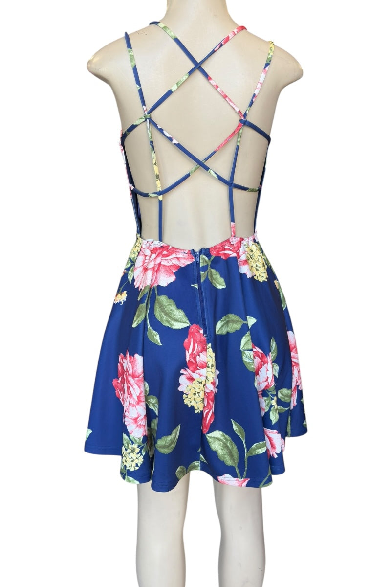 Floral dress with criss-cross back on a mannequin against a white background