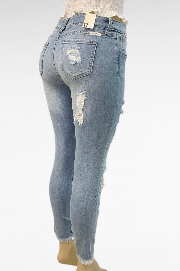 Mid Rise Destructed Skinny Jeans