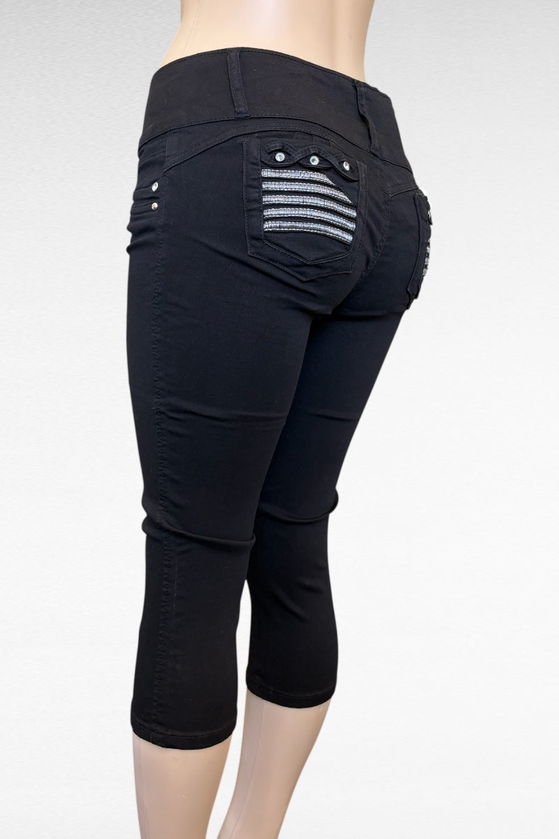Black capri pants with decorative back pocket on a white background