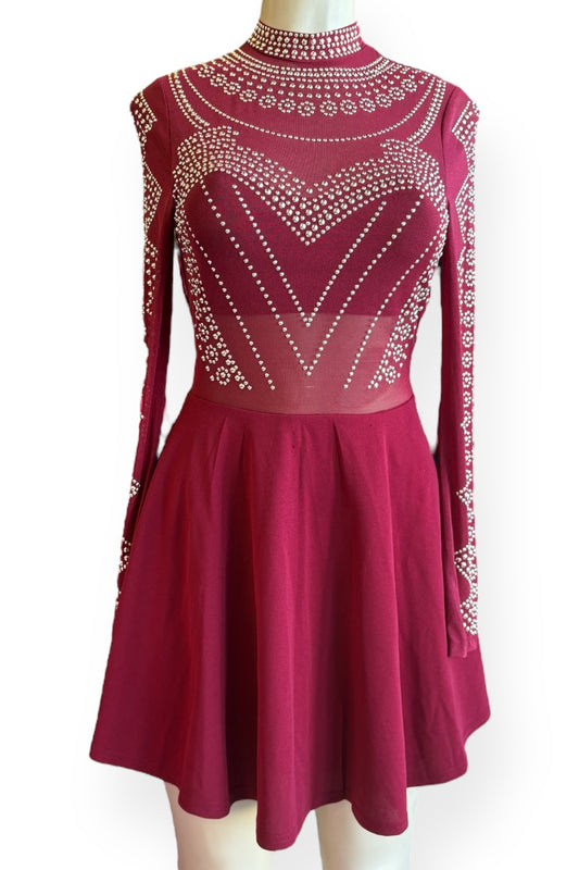 Burgundy dress with intricate beadwork on a white background