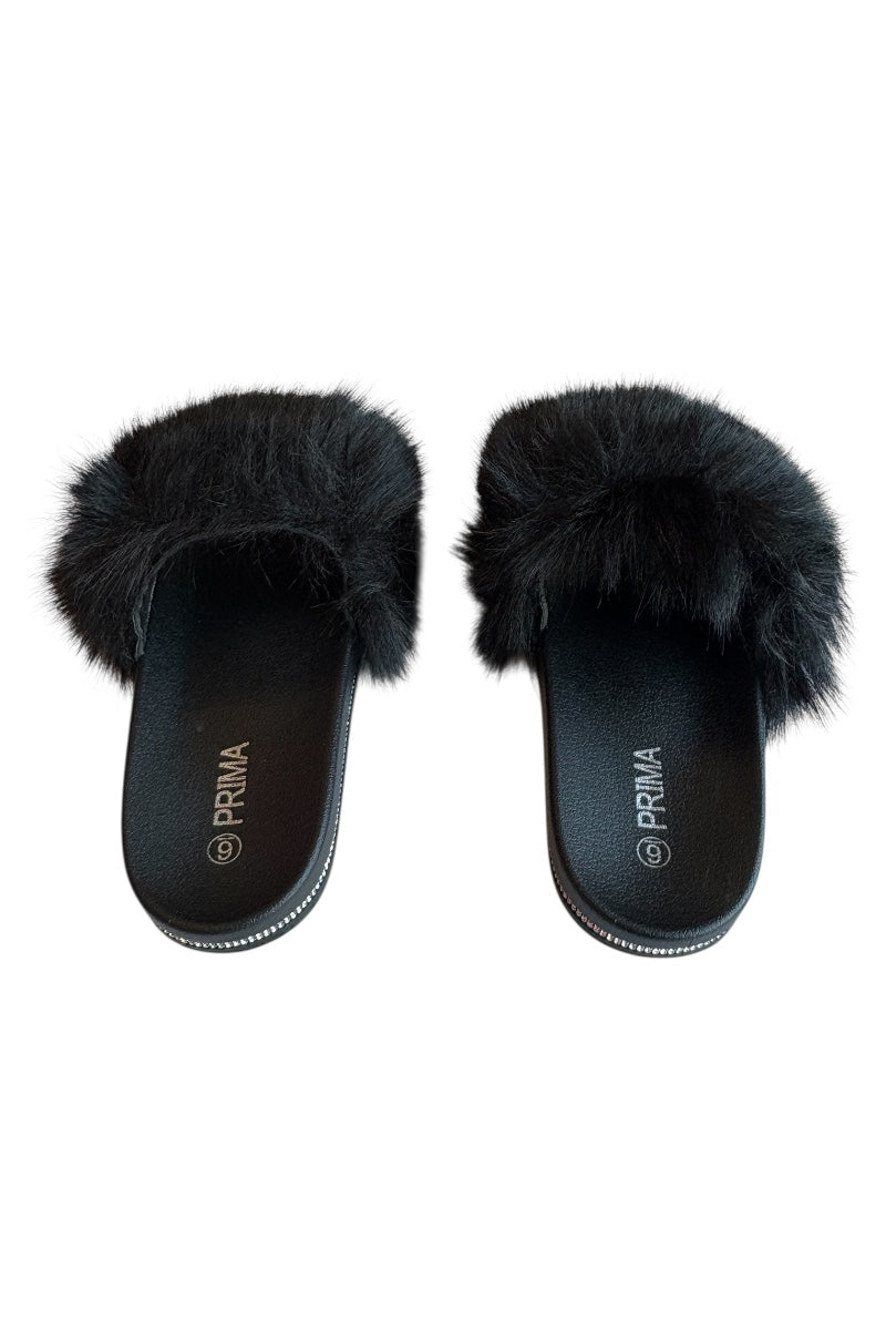 Black fluffy slippers on a white background