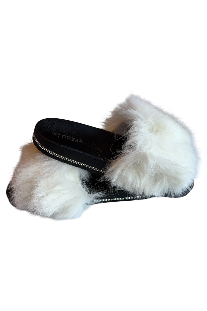 White fur slide sandal with black insole on a white background