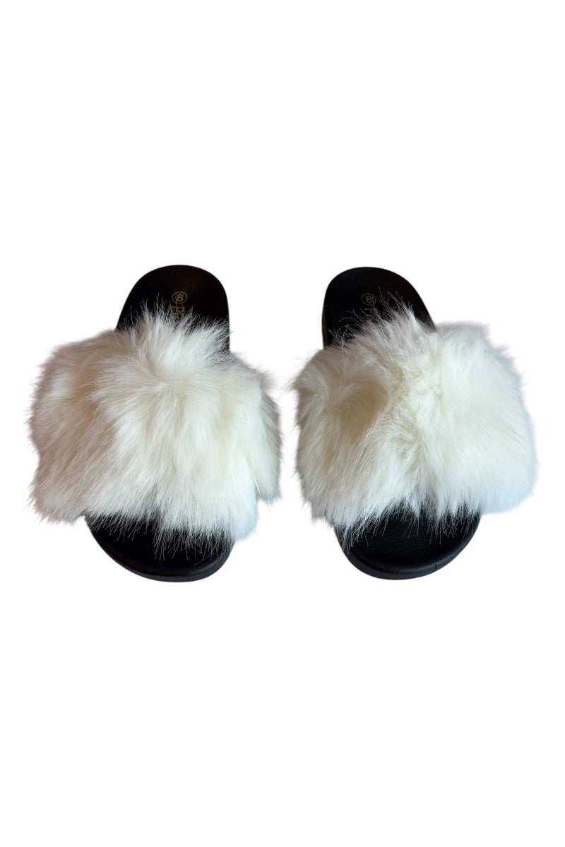 Pair of slippers with fluffy white fur on a white background