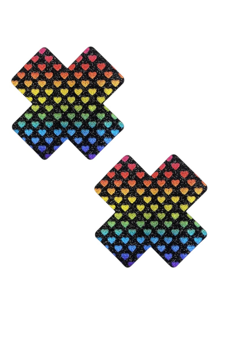 Two colorful 'X' shaped pasties with heart pattern on a white background
