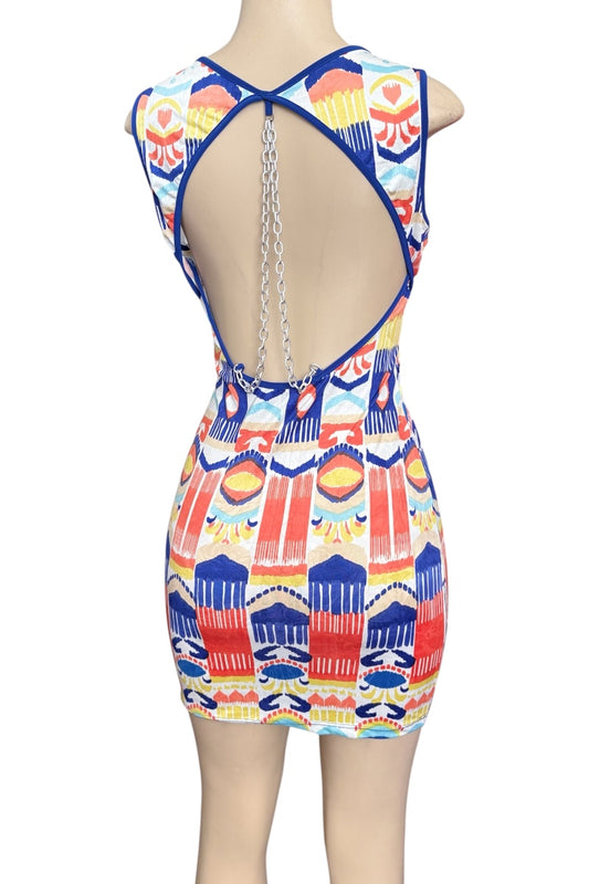 Colorful patterned dress with open back on a mannequin against a white background