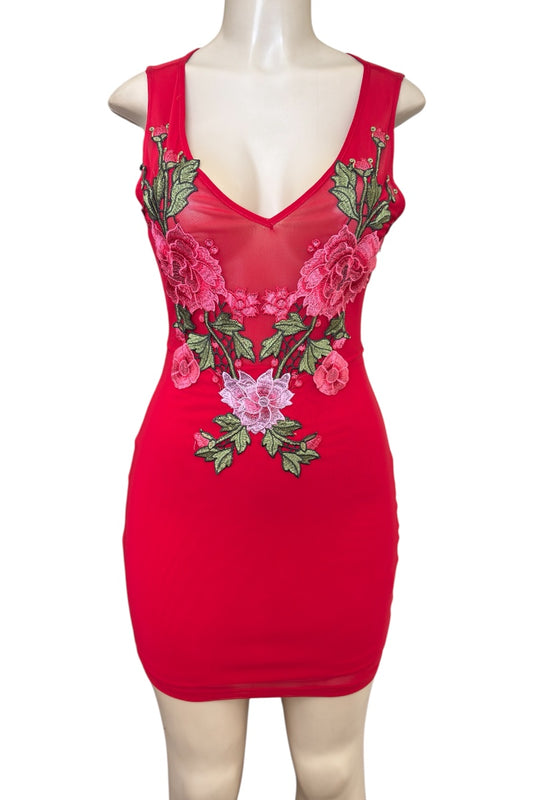 Red dress with floral embroidery on a mannequin against a white background