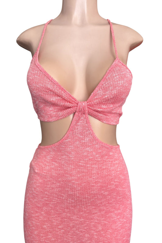 Pink dress with cut-out design on a white background