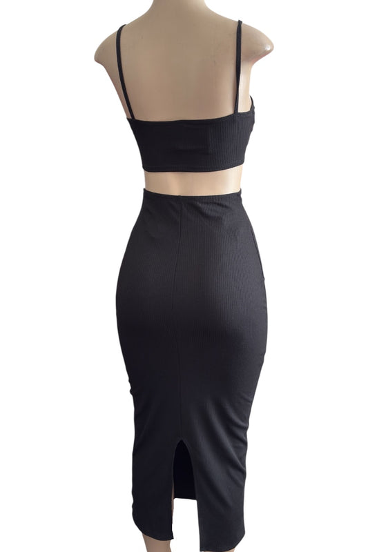 Black dress with on a mannequin against a white background.