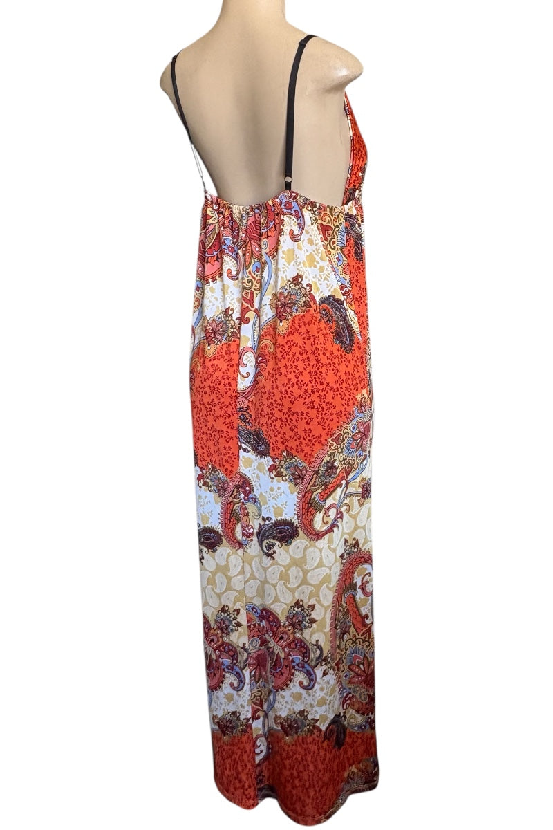 Colorful patterned dress on a mannequin against a white background
