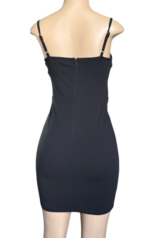 Black dress on a mannequin against a white background