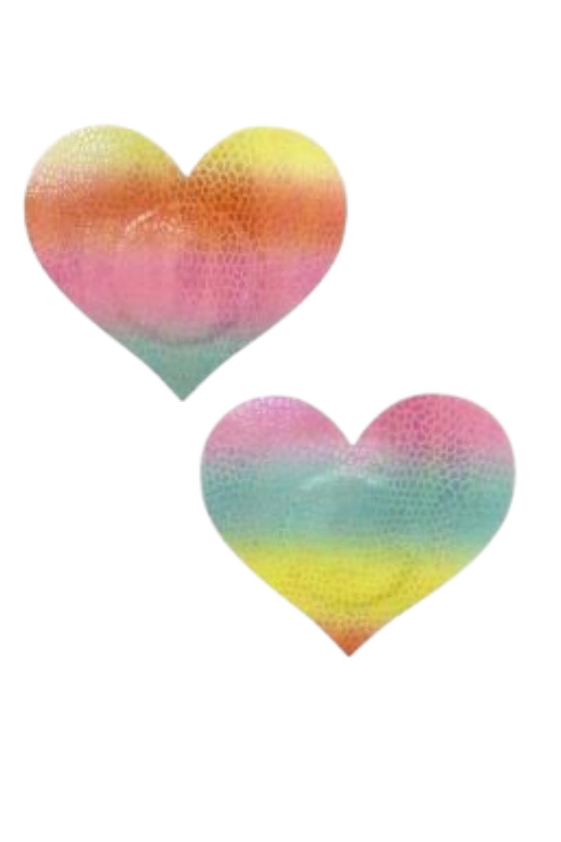 Two heart-shaped pasties with a multicolored gradient on a white background