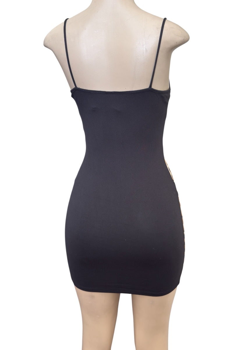 Black dress on a mannequin with thin straps against a white background