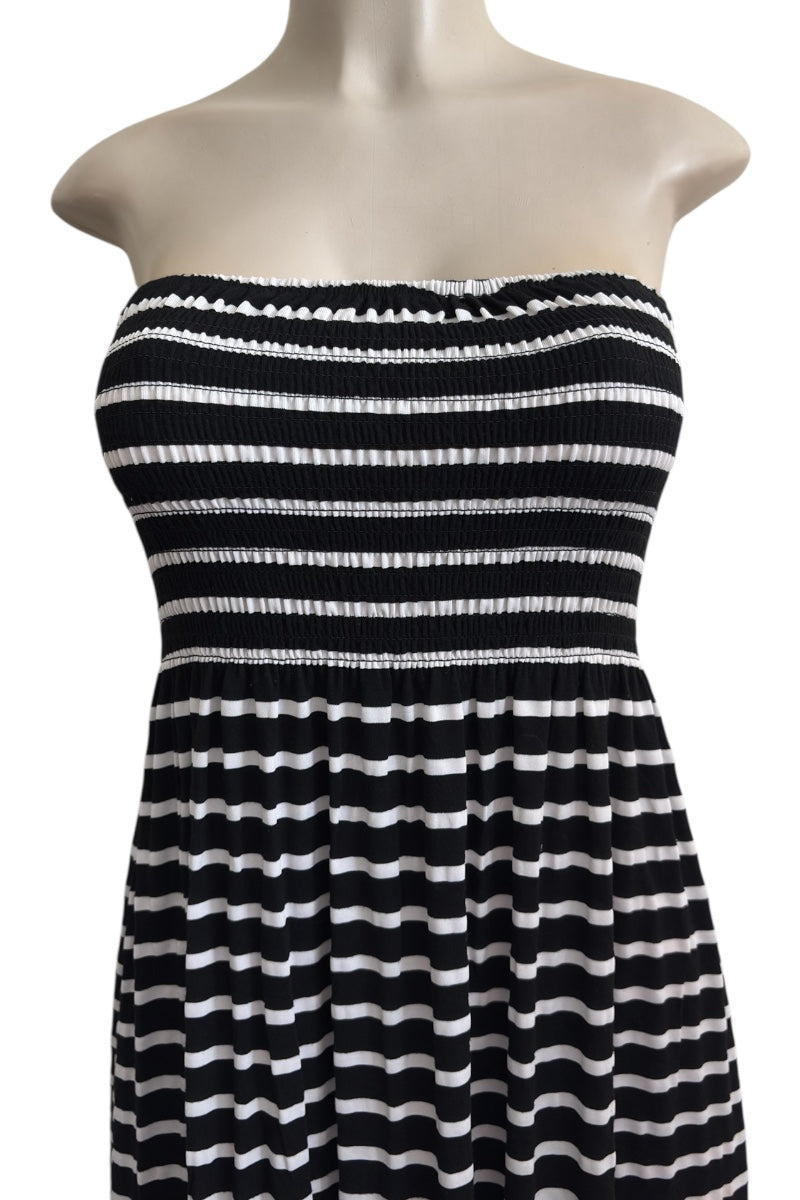 Black and white striped dress on a mannequin against a white background