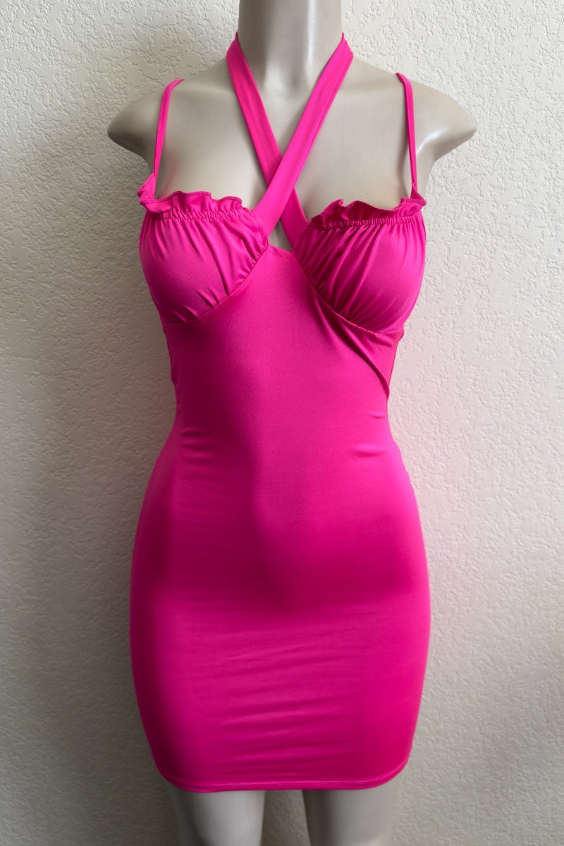 Pink dress on a mannequin against a plain background
