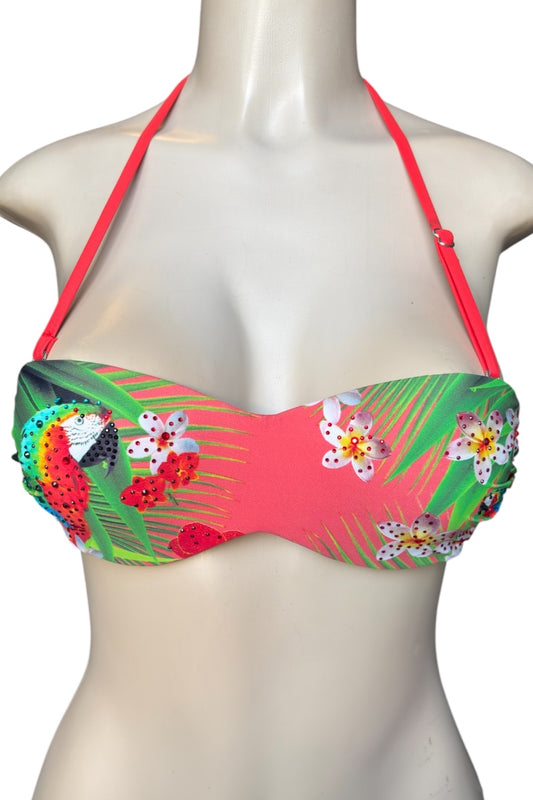 Colorful bikini top with floral and parrot design on a mannequin against a white background