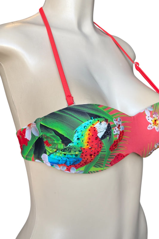 Colorful tropical-themed bikini top on a mannequin against a white background
