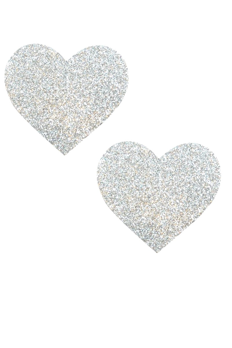 Two glittery heart-shaped pasties on a white background