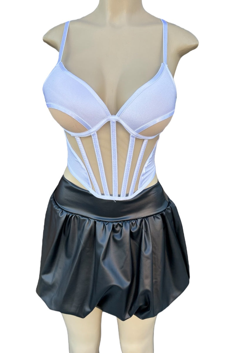 White corset-style top with thin straps and black leather skirt on a mannequin against a white background.