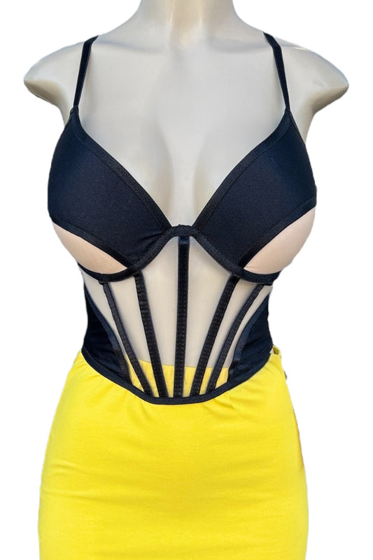 Black corset top with sheer panels on a mannequin against a white background