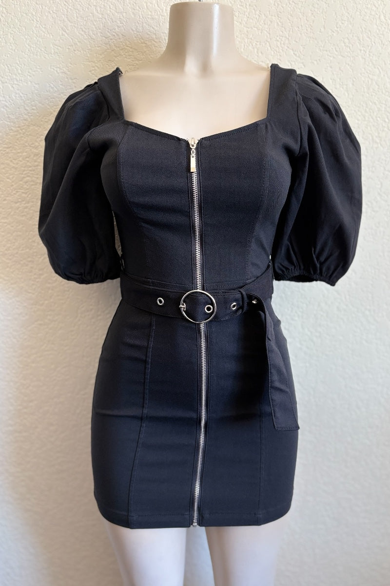 Black dress with puff sleeves on a mannequin against a plain background