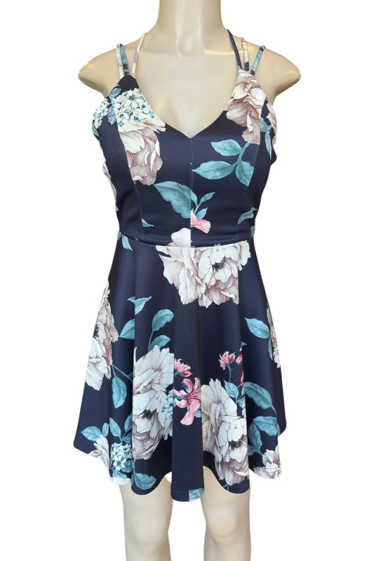 Floral dress on a mannequin against a white background