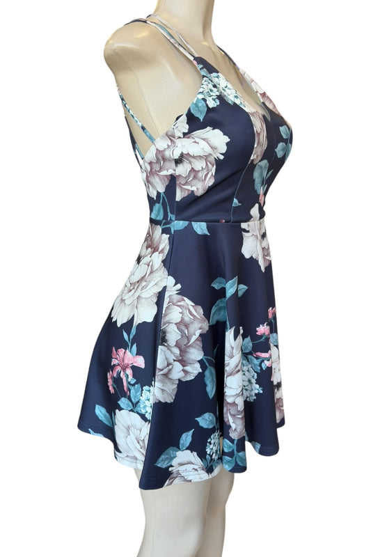 Floral dress on a mannequin against a white background