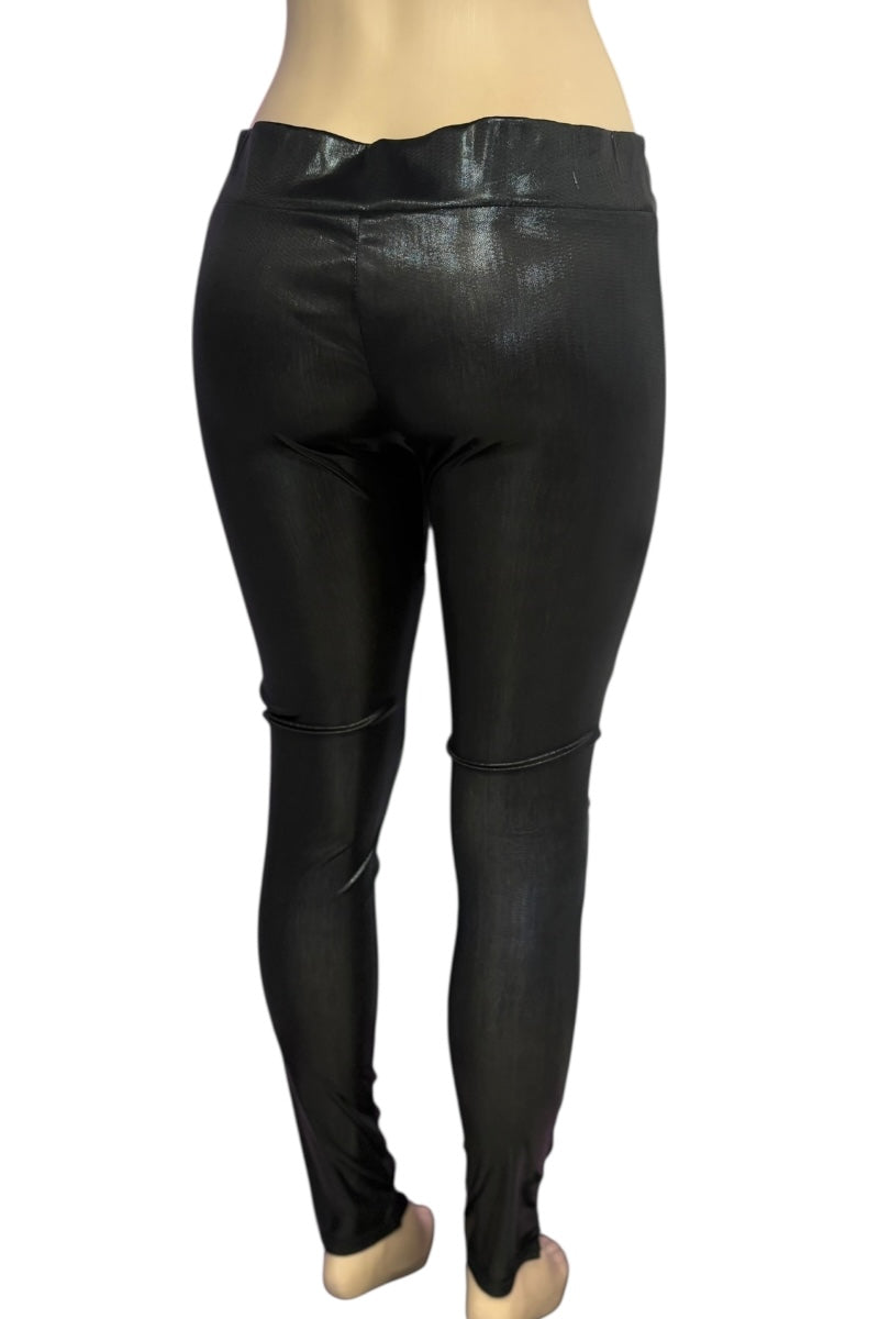 Black leather leggings worn by a person on a white background