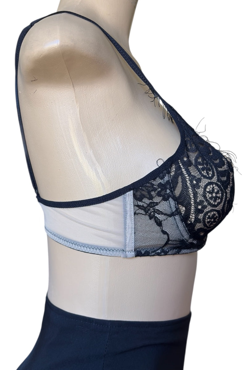 black lace bra on a mannequin with a white background